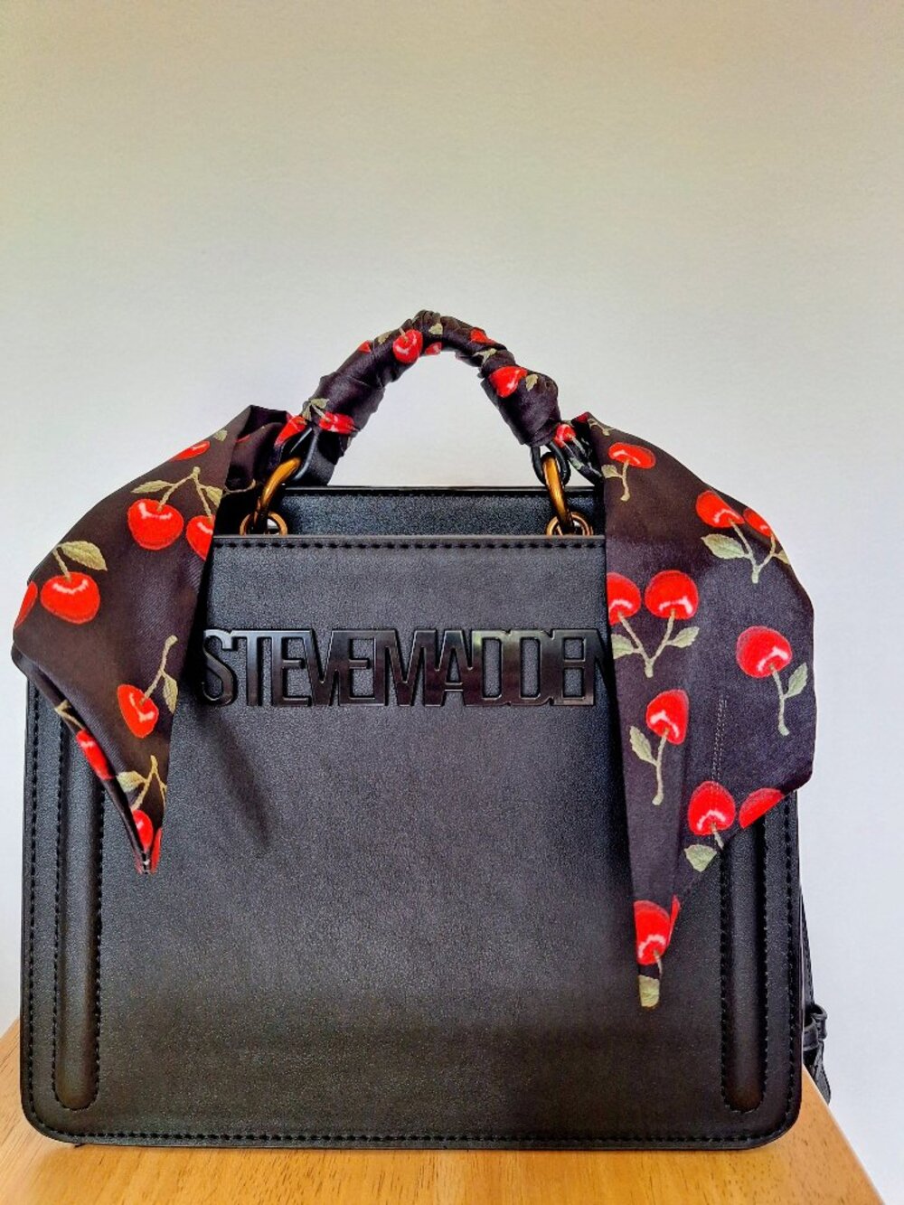 Structured Steve Madden small handbag black with gold hardware and cherry scarf